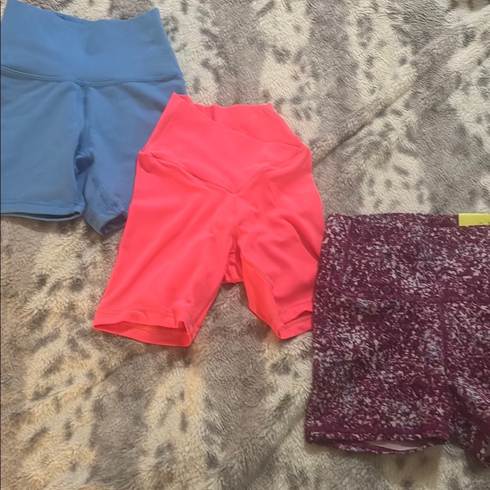 Set of Three Athletic Shorts in Blue, Pink, and Purple